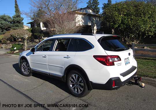 new 2018 Subaru Outback 3.6 Touring, with optional body side moldings, wheel arch moldings etc. Aftermarket 2" trailer hitch with brake light and hitch ball stop people from running into the rear bumper.