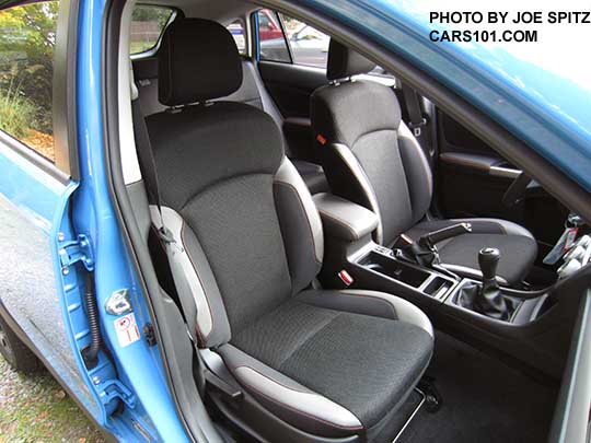 2016 Subaru Crosstrek Premium black cloth interior with orange stitching. Manual transmission shown.