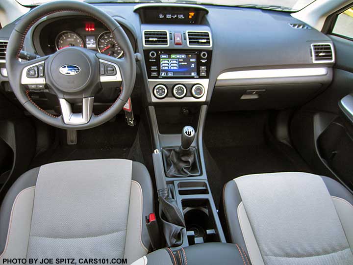2016 Subaru Crosstrek Premium ivory cloth interior with orange stitching. Manual transmission shown