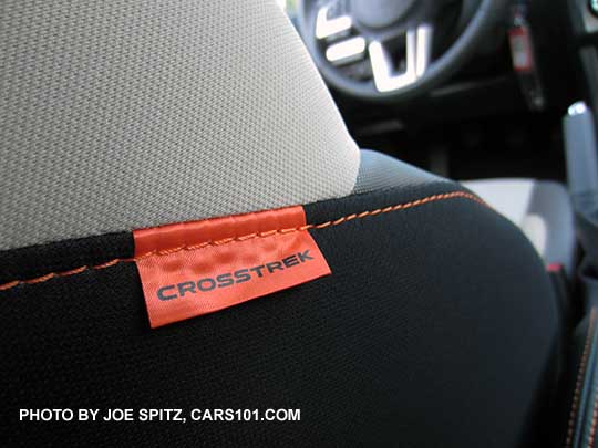 2016 Crosstrek front seats have an orange tag to match the orange stitching on Premium and Limited models. ivory cloth seat shown