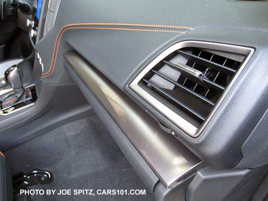 2018 Subaru Crosstrek Limited has silver dash trim, orange thread stitched accent, and silver vent trim.