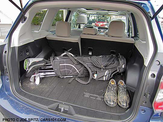 golf clubs in the back cargo narea of a 2014 subaru forester