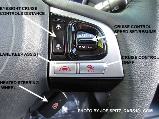diagrammed closeup of the 2017 Outback Touring gray leather wrapped steering wheel's gloss black and silver fingertip controls. Right side shown with Eyesight cruise controls, and lane keep assist. The silver buttons are red lit in this photo because the headlights are, otherwise they are black. The Touring model steering wheel is heated and thats the lower button