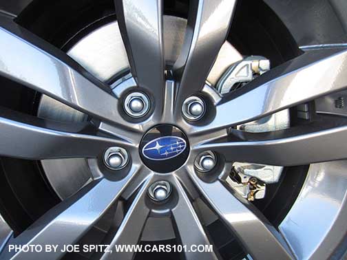 closeup of the center cap on a 2016 Subaru WRX 18" gray 5 split spoke alloy wheel