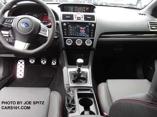 2016 WRX Limited interior dash console manual transmission. Plastic black carbon fiber trim.