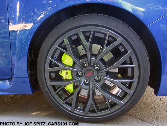 2018 Subaru WRX STI and STI Limited 19" alloy wheel, with drilled brake rotors, yellow brake calipers. Shown on a WR Blue car.